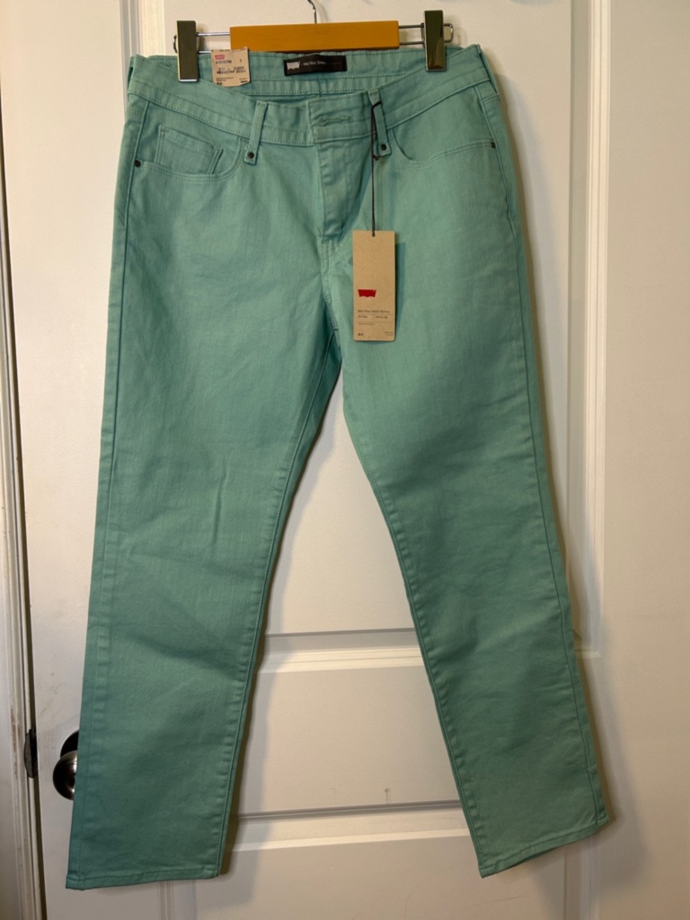 119. Levi's Women's Straight Leg Jeans in Mint Green